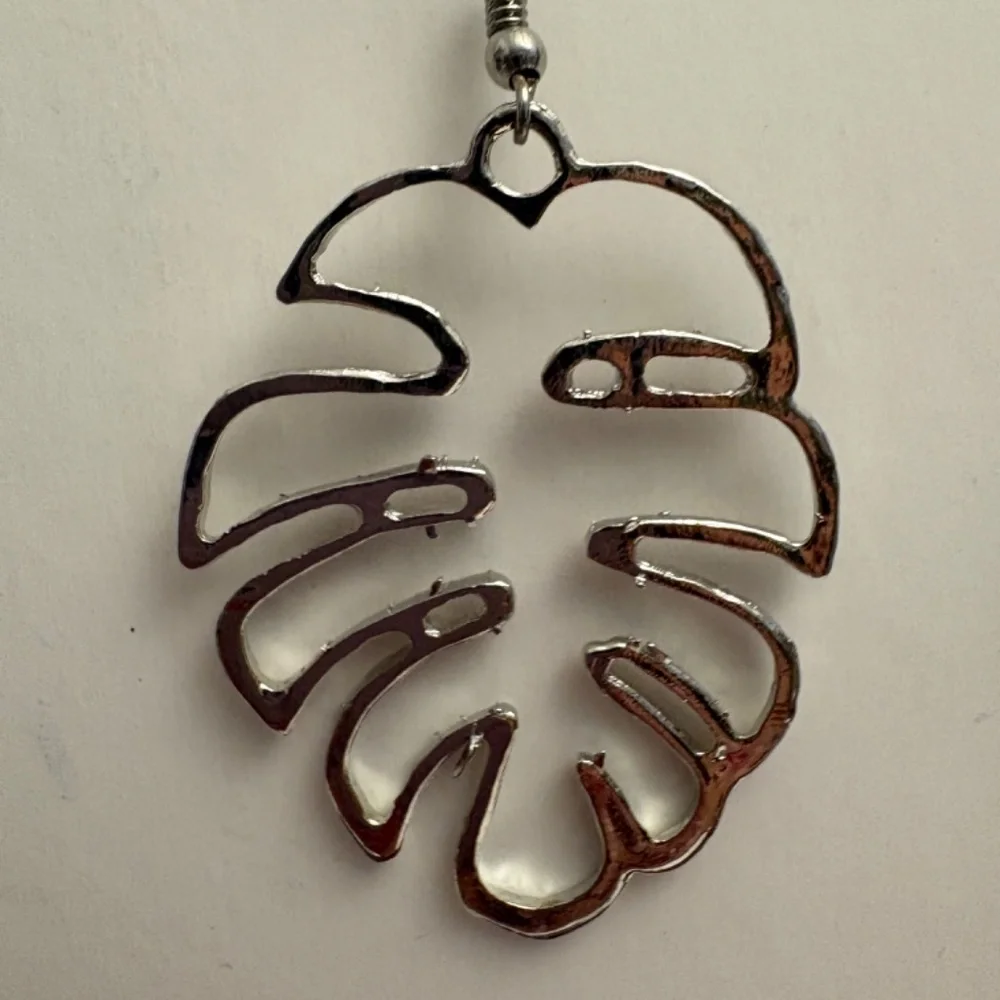 Palm Leaf Earrings in Silvertone.